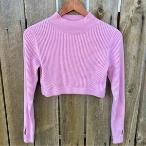 pink cropped sweater with thumb holes